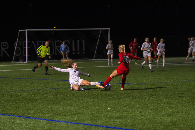 mvnu-womens-soccer-night-slide-tackle